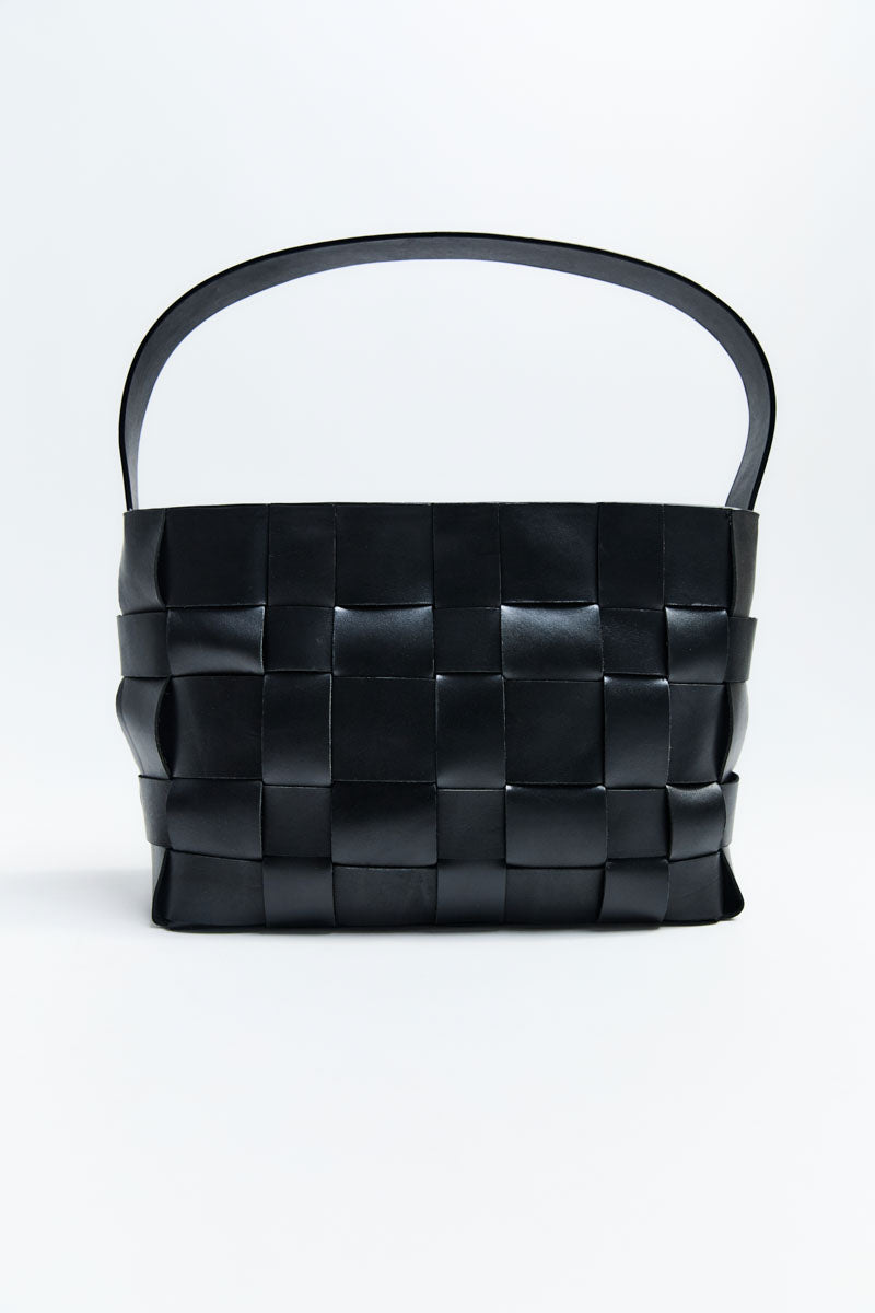 Black woven handbag on a white background