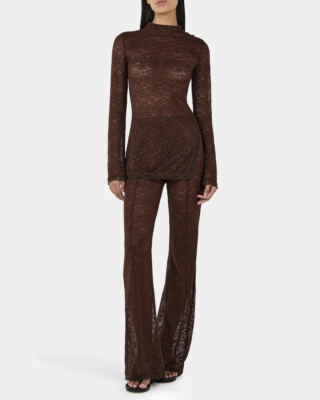 Clive Chocolate Lace Top — sheer long sleeves, longline, button‑opening at shoulder, on model