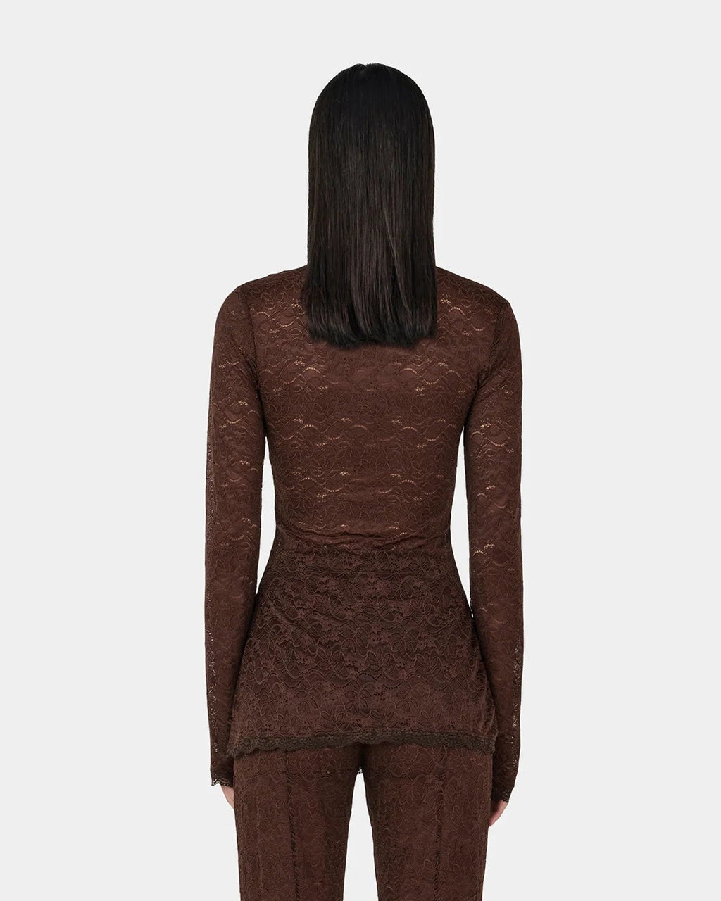 Clive Chocolate Lace Top — sheer long sleeves, longline, button‑opening at shoulder, on model, back view