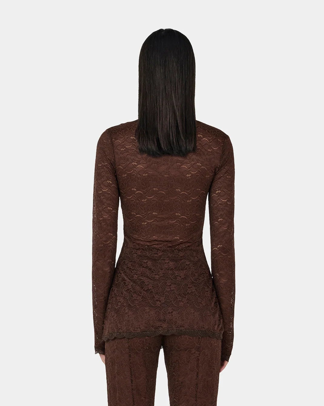 Clive Chocolate Lace Top — sheer long sleeves, longline, button‑opening at shoulder, on model, back view
