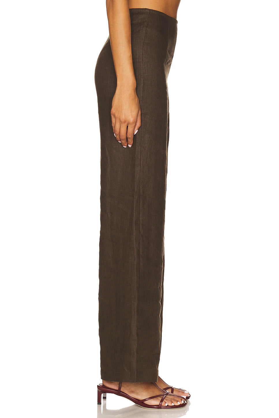 Brown pants worn by a person on a white background