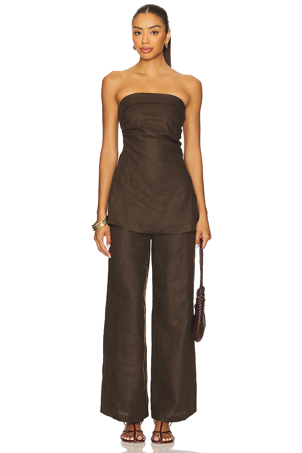 Woman wearing a brown linen set with a strapless top and matching pants