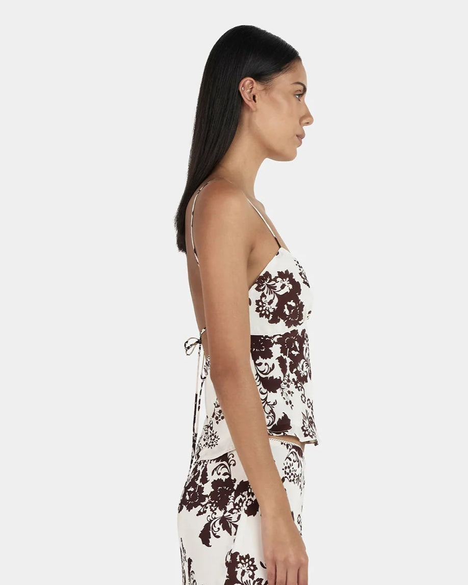 Karly Cami in crème floral—relaxed-fit mid-length camisole with adjustable rouleau straps and keyhole detail on model