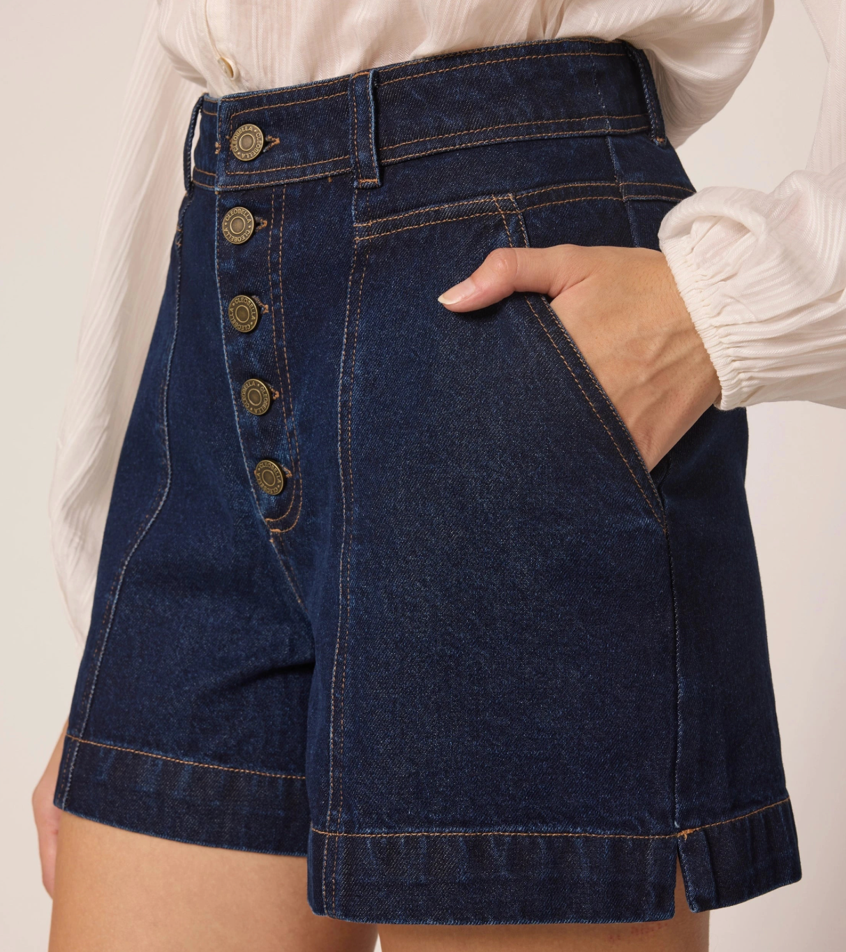 high waisted dark denim shorts with ivory top