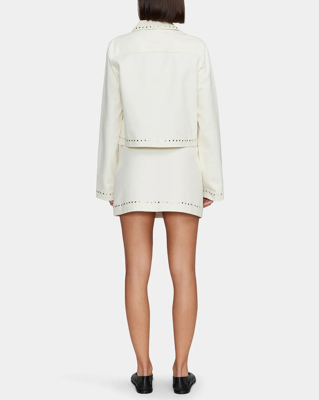Women's cream colored mini skirt with studs