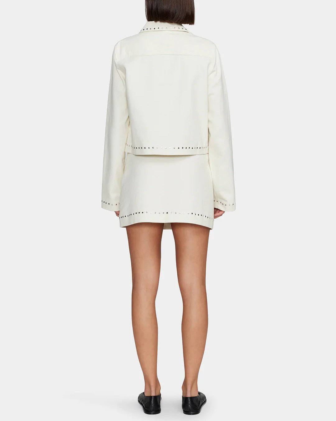 Women's cream colored mini skirt with studs