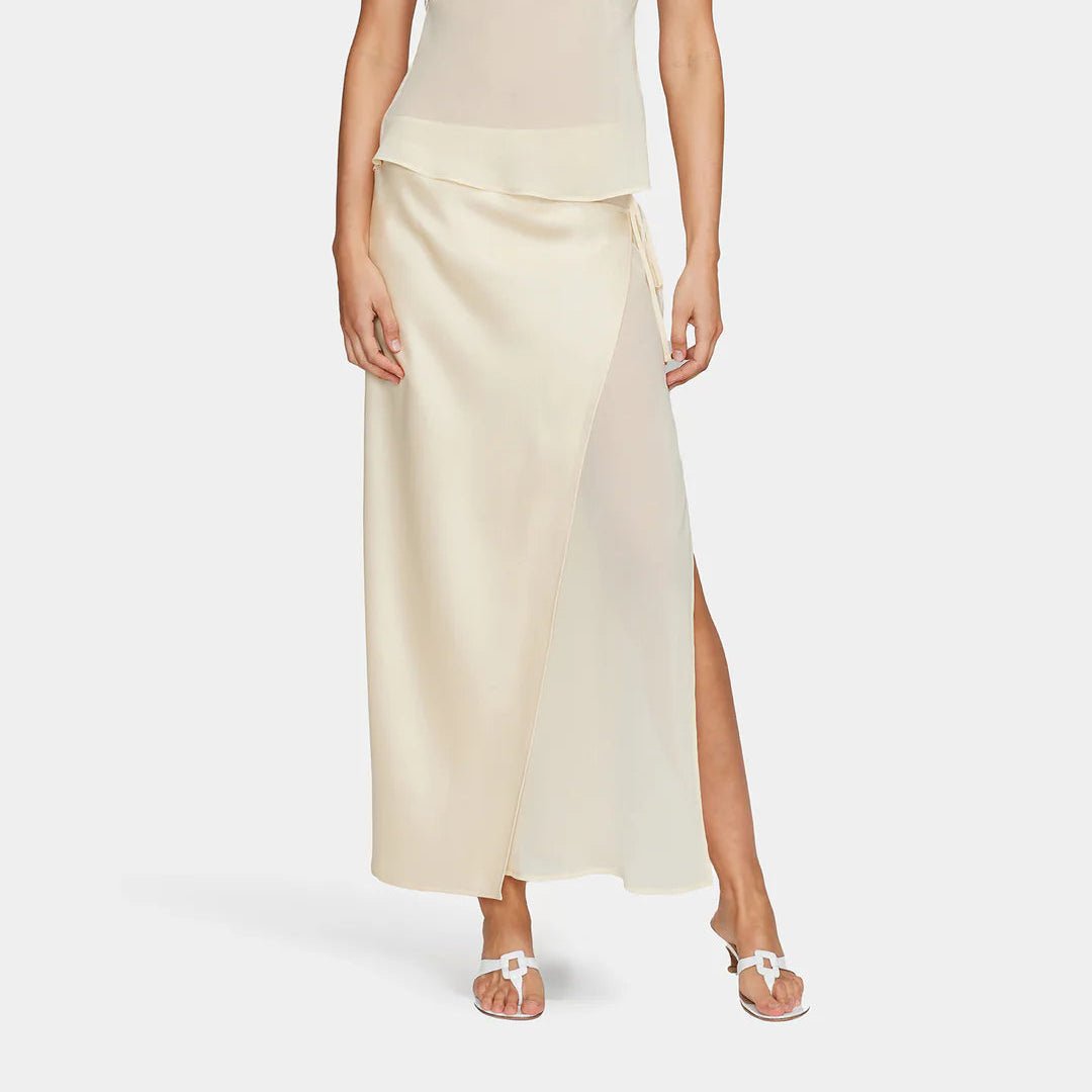Pale yellow sating and sheer skirt with slit