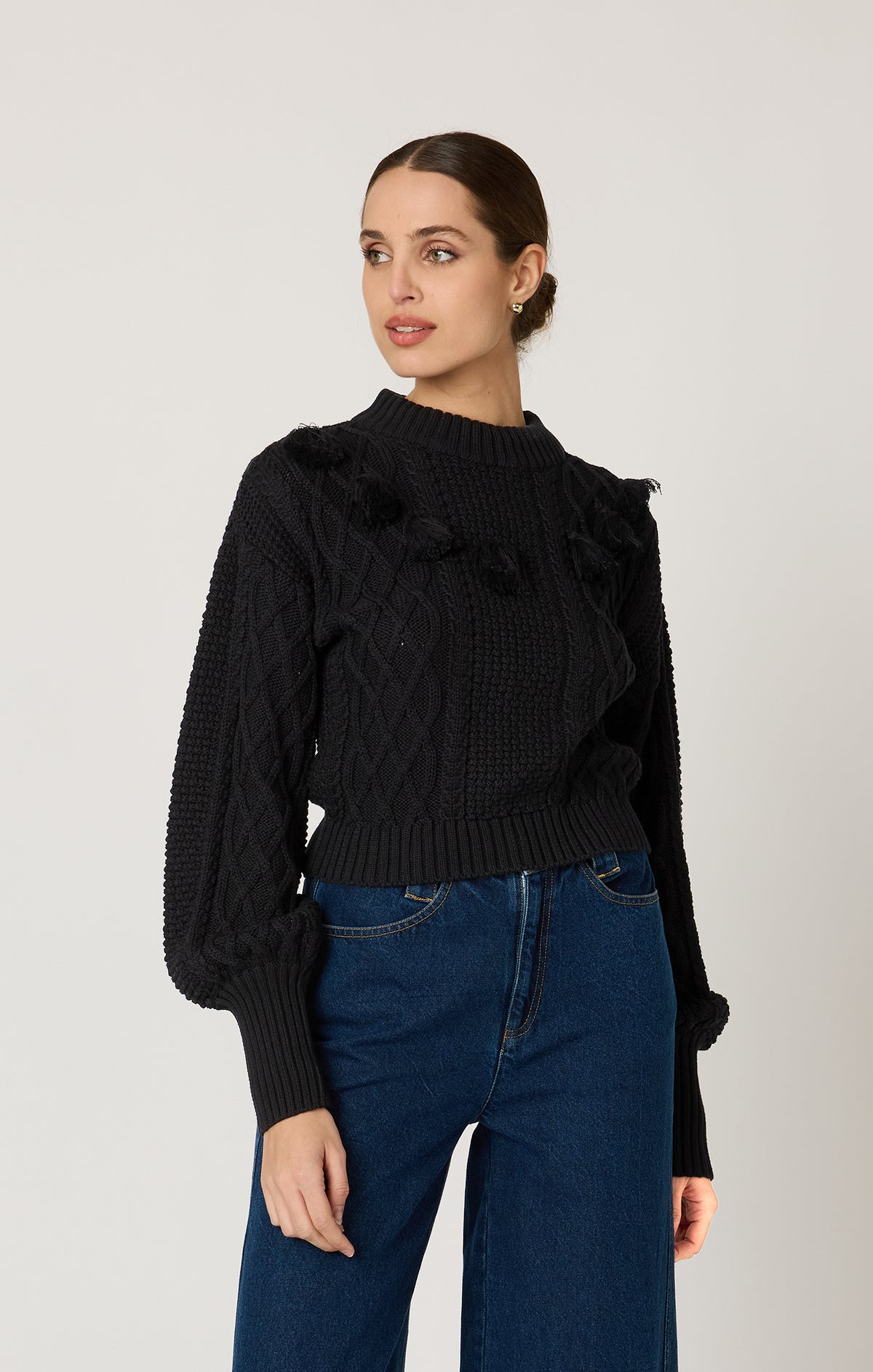 Cleobella Bettina Sweater in black — organic cotton women’s knit with tassel details.